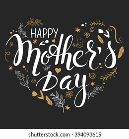 vector hand drawn mothers day lettering heart shaped with branches, swirls, flowers, feathers and quote - happy mothers day - in gold color. Can be used as mothers day card or poster.