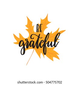 Vector hand drawn motivational and inspirational quote - Be grateful. Thanksgiving Day calligraphic poster isolated on yellow maple leaf