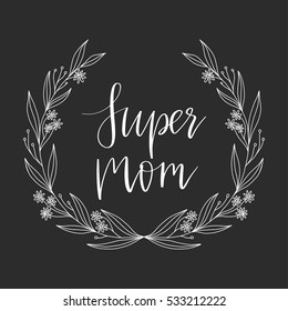Vector hand drawn motivational and inspirational quote - Super Mom. Calligraphic poster with floral wreath. Mother's Day design
