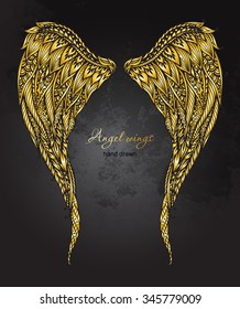 Vector hand drawn ornate golden angel wings in zentangle style. Doodle  illustration on grunge background. 