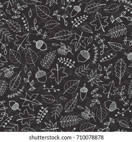 Vector hand drawn pattern with autumn elements contours: foliage, berries and acorns on the dark gray background. Maple, sycamore, birch, beech and oak tree leaves. Chalkboard imitation.