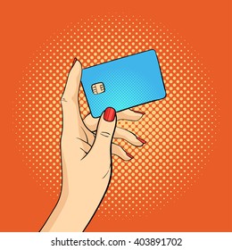 Vector hand drawn pop art illustration of hand holding credit card. Retro style. Hand drawn sign. Illustration for print, web.
