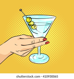 Vector hand drawn pop art illustration of woman hand holding Martini glass with olives. Retro style. Hand drawn sign. Illustration for print, web.