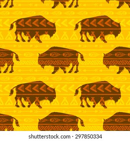 vector hand drawn seamless pattern with bison in the style of boho or hippy. Tribal elements