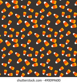 Vector hand drawn seamless pattern with  candy corn. Cartoon style. Holiday background