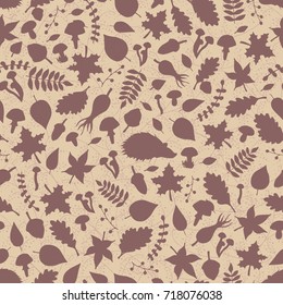Vector hand drawn seamless pattern with autumn elements silhouettes: foliage, berries, acorns, mushrooms, oak and maple leaves, rose hips and hedgehogs. Cute fall ornament.