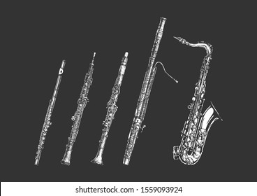 Vector hand drawn set of woodwind musical instruments.  Flute,  oboe, clarinet, bassoon and saxophone.