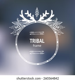 Vector hand drawn tribal frame with arrows, indian feathers and horns on blurred background