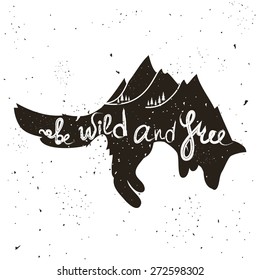 Vector hand drawn typographic poster with jumping fox, mountains and trees. Be wild and free. Inspirational and motivational hipster style illustration