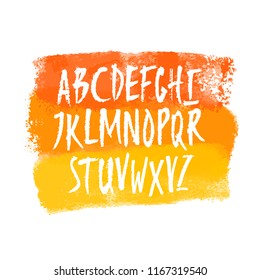 Vector hand drawn uppercase letters on colorful watercolor banner. Isolated on white background. Clipping paths included.