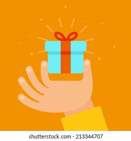 Vector hand giving present in flat style - gift concept illustration