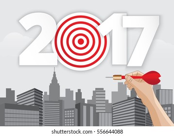 Vector hand holding dart aiming at the business target new year 2017.illustration EPS10