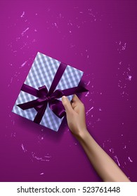 Vector hand holding gift box, bows and ribbons 