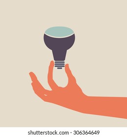 Vector hand holding a LED light bulb sign.