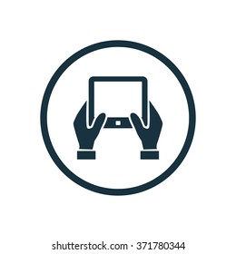 Vector hand holding tablet Icon