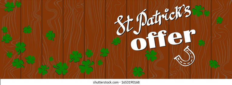 Vector hand lettering Banner with special offer for St Patricks Day.Vector illustration with randomly green shamrocks on a orange textured wood background. Sale & offer concept for St. Patrick's Day.