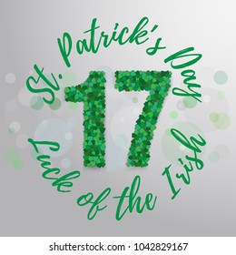 Vector hand lettering saint patrick's day greetings card with clover shapes.