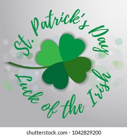 Vector hand lettering saint patrick's day greetings card with clover shape and branche.