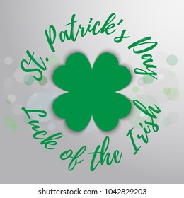 Vector hand lettering saint patrick's day greetings card with clover shapes.
