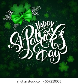 vector hand lettering st Patrick's day greetings text with clover, ribbon bow and branches.