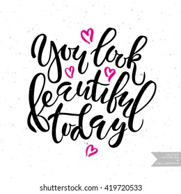 Vector hand lettering typography 'You look beautiful today'. Inspirational quote for poster, banner. Brush script calligraphy concept for beauty salon, fashion magazine, shopping store
