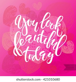 Vector hand lettering typography 'You look beautiful today'. Inspirational quote for poster, banner. Brush script calligraphy concept for beauty salon, fashion magazine, shopping store
