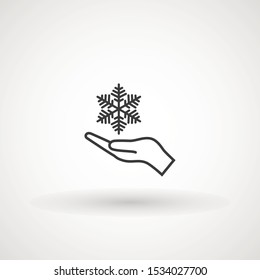 Vector hand and snowflake icon, logo on white background. Hand holding snowflake icon