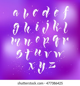 Vector hand written brush pen script. Hand drawn calligraphic latin alphabet. Cute isolated letters on an abstract background.