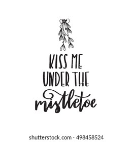 Vector hand written winter phrase - Kiss me under the mistletoe. Black calligraphy poster isolated on white background. Great print for your design