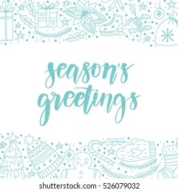 Vector hand written winter phrase - Season's greetings. Blue calligraphy poster isolated on white background with doodled christmas elements