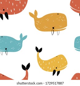 Vector hand-drawn colored childish seamless repeating simple flat pattern with whales in scandinavian style on a white background. Cute baby animals. Pattern for kids with whales. Sea. Ocean.
