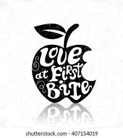 Vector hand-drawn lettering typographic design. Love at first bite. The symbol of apple.