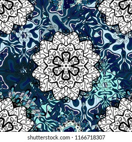 Vector hand-drawn mandala, colored abstract pattern on a blue, white and black colors.