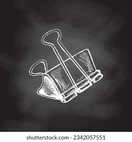 Vector hand-drawn school and office supplies Illustration. Detailed retro style binder clip sketch on chalkboard background. Vintage sketch element. Back to School. School essential illustration. 