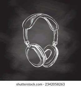 Vector hand-drawn school and office supplies Illustration. Detailed retro style headphones sketch on chalkboard background. Vintage sketch element. Back to School. School essential illustration. 