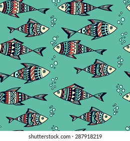 Vector hand-drawn seamless pattern with fishes. 