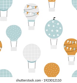 Vector hand-drawn seamless repeating children simple pattern with air balloons in Scandinavian style on a white background. Kids seamless pattern with air balloons. Funny transport. Aircraft.
