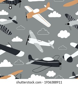 Vector hand-drawn seamless repeating children simple pattern with aircraft and clouds in Scandinavian style on a gray background.Kids seamless pattern with planes. Funny airplanes.