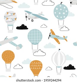 Vector hand-drawn seamless repeating children simple pattern with air balloons, clouds and planes in Scandinavian style on a white background. Kids seamless pattern with aircraft. Funny transport.