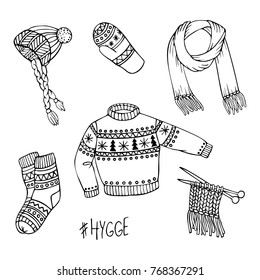 Vector hand-drawn set of knitted clothes. Hygge doodles - socks, mittens, woolen sweater, winter hat, knitting, warm scarf