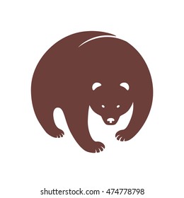 Vector hand-drawn silhouette of a brown bear, inscribed in a circle for the logo, trademark, icon, symbol, or advertising. Isolated on background.