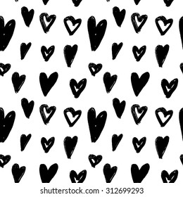 Vector hand-painted seamless pattern with ink hearts. Abstract background. Doodles.