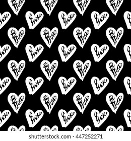 Vector hand-painted seamless pattern with ink hearts. Abstract background. Doodles.