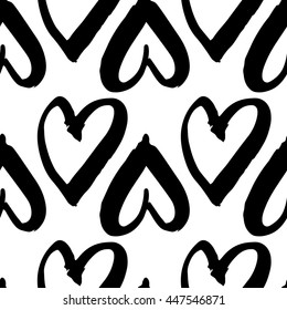 Vector hand-painted seamless pattern with ink hearts. Abstract background. Doodles.
