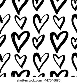 Vector hand-painted seamless pattern with ink hearts. Abstract background. Doodles.
