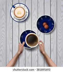 Vector hands holding cup of coffee.  workspace. Blue plates with flowers ornament. latte with foam in the form of heart