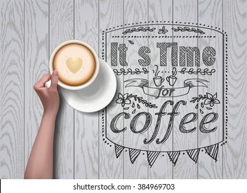 Vector hands holding cup of coffee on white wooden background. workspace 
