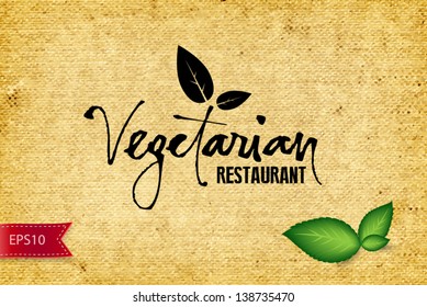 Vector  handwritten calligraphy Vegetarian over old vintage canvas background with three green leaves