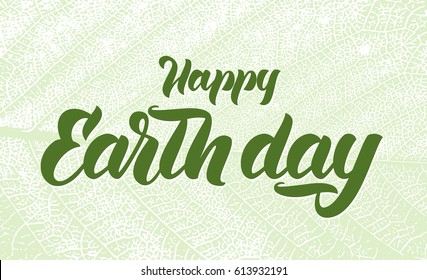 Vector Handwritten lettering of Happy Earth Day on leaf texture background. 