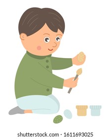 Vector happy boy coloring egg with paint and brush. Easter funny character and design element. Cute spring icon picture